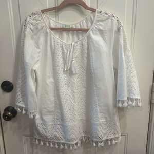 Jade white top with eyelet down sleeve and the front and back.
